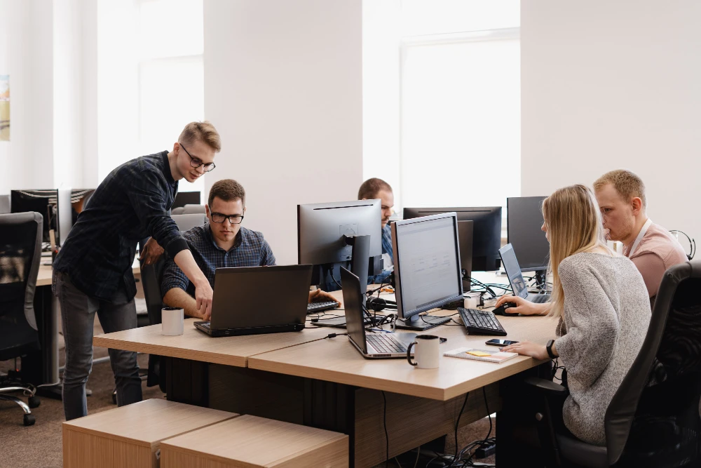 IT support team in Milford DE working at computers for Wagamon Technology Group